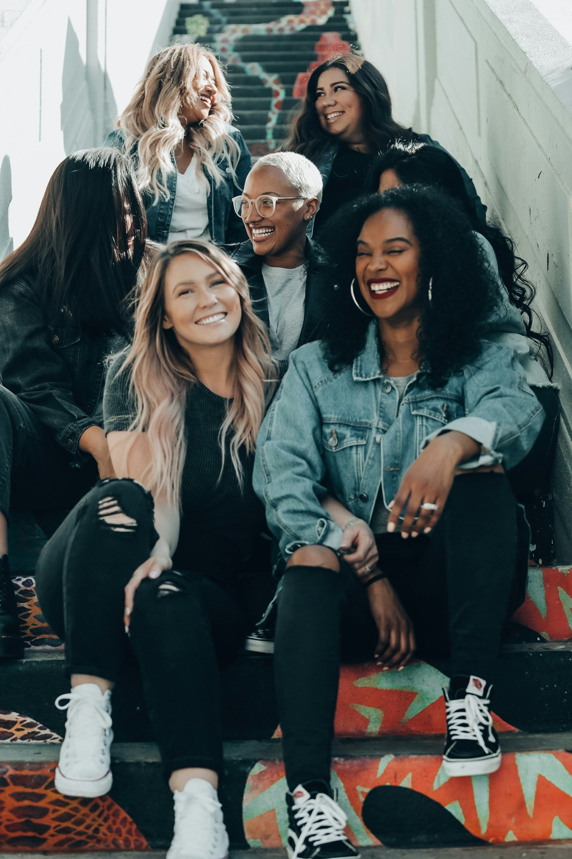 women sitting on the stairs