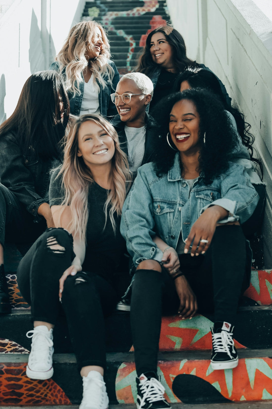 women sitting on the stairs